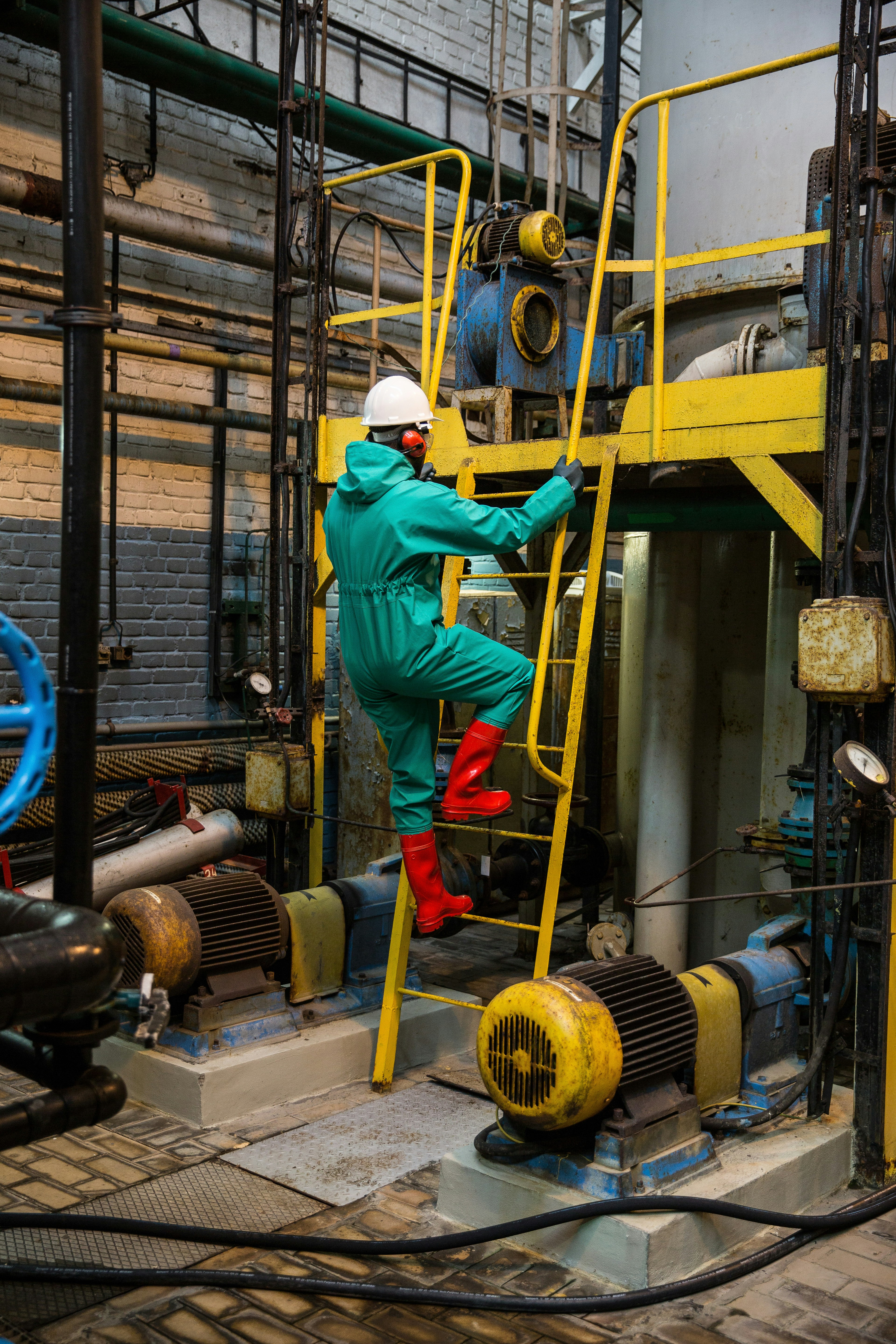 Industrial workers practising confined space safety